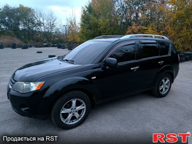 Черный Мицубиси Аутлендер, объемом двигателя 2.4 л и пробегом 210 тыс. км за 7800 $, фото 1 на Automoto.ua