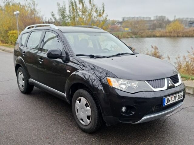 Черный Мицубиси Аутлендер, объемом двигателя 2 л и пробегом 226 тыс. км за 4700 $, фото 1 на Automoto.ua