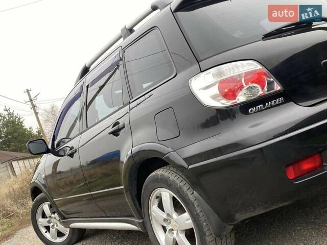 Черный Мицубиси Аутлендер, объемом двигателя 2.4 л и пробегом 178 тыс. км за 6900 $, фото 12 на Automoto.ua
