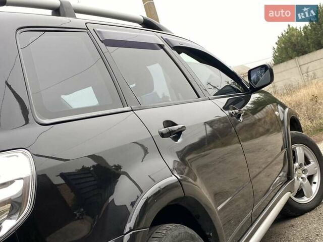 Черный Мицубиси Аутлендер, объемом двигателя 2.4 л и пробегом 178 тыс. км за 6900 $, фото 21 на Automoto.ua