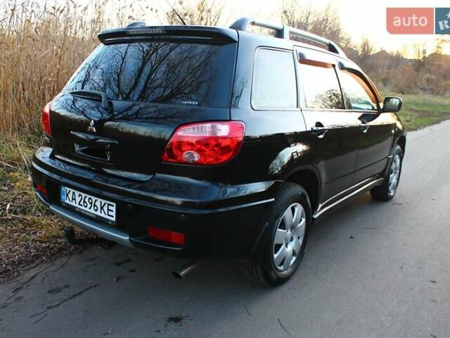 Черный Мицубиси Аутлендер, объемом двигателя 2 л и пробегом 189 тыс. км за 7200 $, фото 23 на Automoto.ua