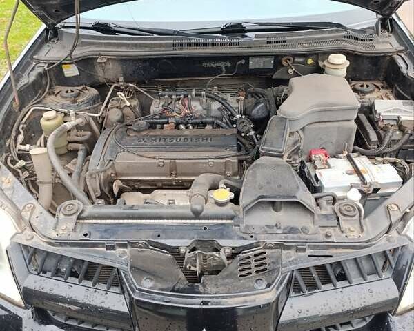 Мицубиси Аутлендер 2008 в Изюме на Automoto.ua Черный Мицубиси Аутлендер, объемом двигателя 2 л и пробегом 270 тыс. км за 7200 $, фото 4 на Automoto.ua