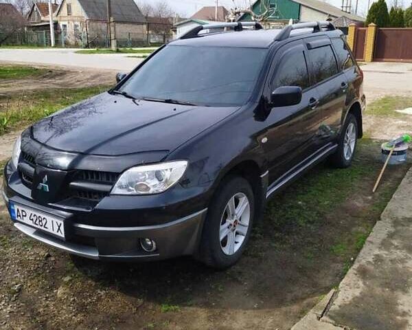 Черный Мицубиси Аутлендер, объемом двигателя 2 л и пробегом 263 тыс. км за 6900 $, фото 1 на Automoto.ua