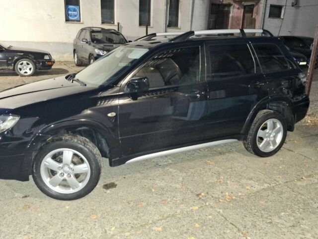 Чорний Міцубісі Аутлендер, об'ємом двигуна 2 л та пробігом 117 тис. км за 7900 $, фото 6 на Automoto.ua