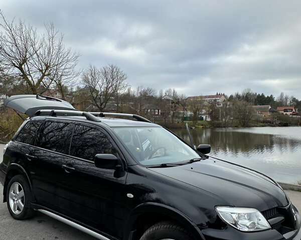 Чорний Міцубісі Аутлендер, об'ємом двигуна 2 л та пробігом 118 тис. км за 8100 $, фото 43 на Automoto.ua