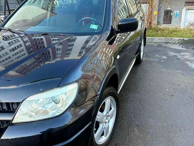 Черный Мицубиси Аутлендер, объемом двигателя 2.4 л и пробегом 231 тыс. км за 8500 $, фото 5 на Automoto.ua