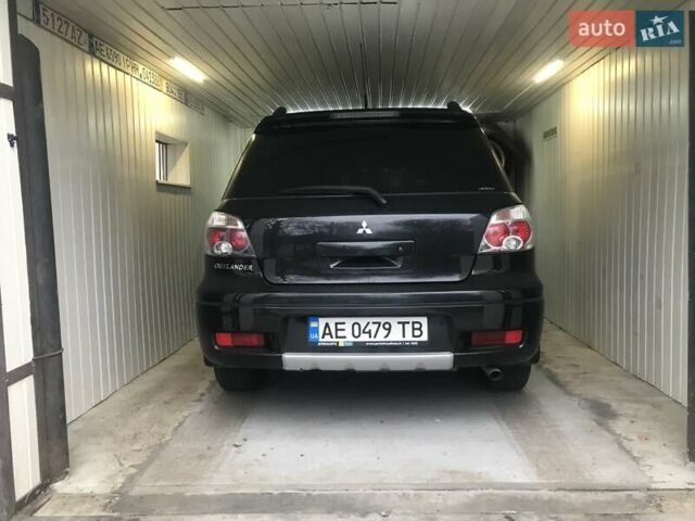 Чорний Міцубісі Аутлендер, об'ємом двигуна 2.38 л та пробігом 207 тис. км за 7000 $, фото 46 на Automoto.ua