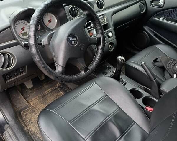 Мицубиси Аутлендер 2008 в Изюме на Automoto.ua Черный Мицубиси Аутлендер, объемом двигателя 2 л и пробегом 270 тыс. км за 7200 $, фото 1 на Automoto.ua