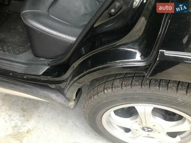 Чорний Міцубісі Аутлендер, об'ємом двигуна 2.38 л та пробігом 207 тис. км за 7000 $, фото 41 на Automoto.ua