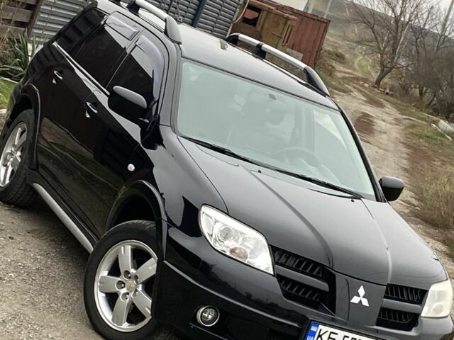 Черный Мицубиси Аутлендер, объемом двигателя 2.4 л и пробегом 178 тыс. км за 6900 $, фото 4 на Automoto.ua