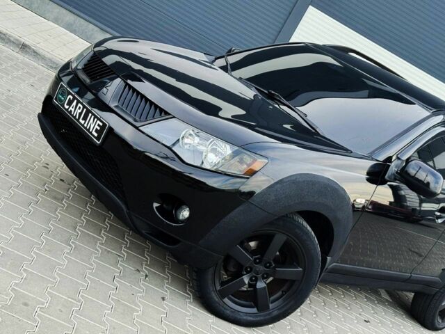 Черный Мицубиси Аутлендер, объемом двигателя 2.4 л и пробегом 199 тыс. км за 6470 $, фото 4 на Automoto.ua