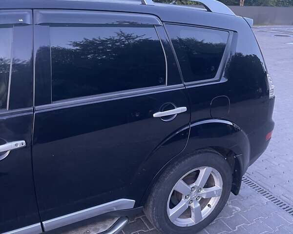 Черный Мицубиси Аутлендер, объемом двигателя 2.4 л и пробегом 290 тыс. км за 9500 $, фото 6 на Automoto.ua