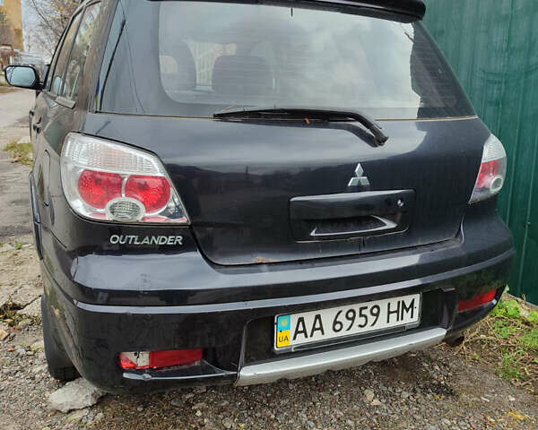 Чорний Міцубісі Аутлендер, об'ємом двигуна 2.4 л та пробігом 200 тис. км за 6790 $, фото 2 на Automoto.ua