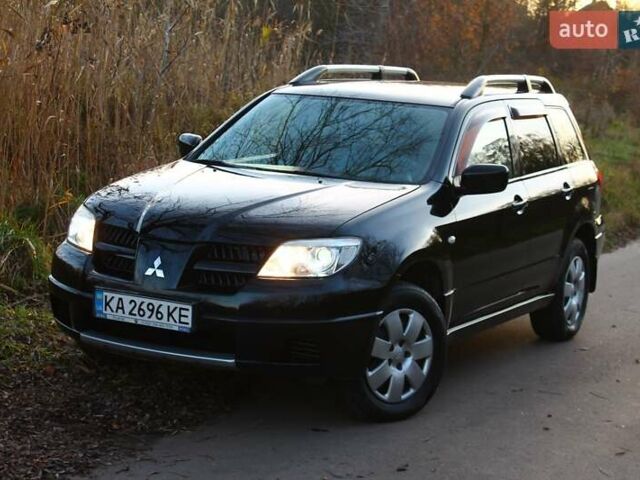 Черный Мицубиси Аутлендер, объемом двигателя 2 л и пробегом 190 тыс. км за 6900 $, фото 6 на Automoto.ua