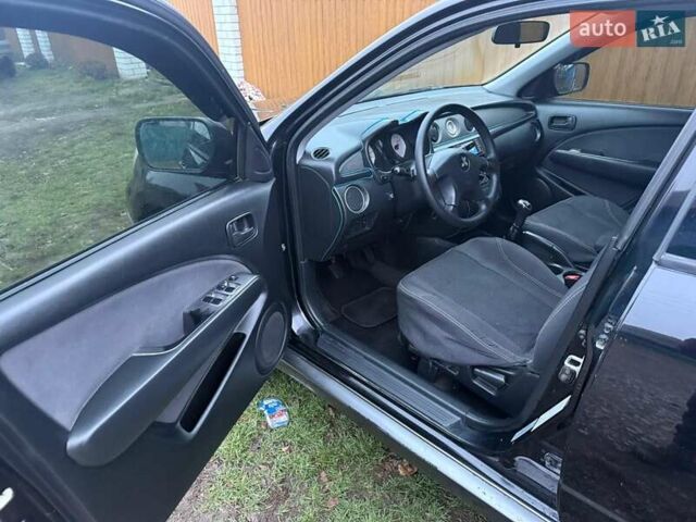 Черный Мицубиси Аутлендер, объемом двигателя 2 л и пробегом 232 тыс. км за 7000 $, фото 13 на Automoto.ua