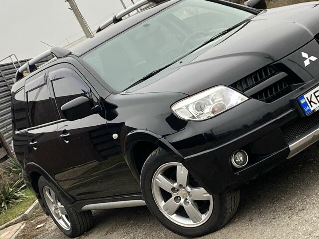 Черный Мицубиси Аутлендер, объемом двигателя 2.4 л и пробегом 178 тыс. км за 6900 $, фото 3 на Automoto.ua