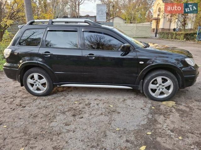 Чорний Міцубісі Аутлендер, об'ємом двигуна 2.38 л та пробігом 245 тис. км за 6800 $, фото 7 на Automoto.ua