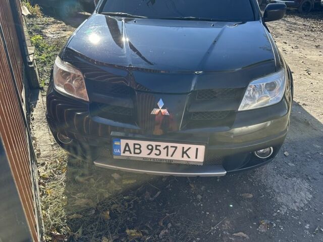 Черный Мицубиси Аутлендер, объемом двигателя 2.4 л и пробегом 350 тыс. км за 7999 $, фото 5 на Automoto.ua