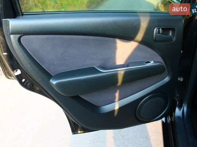 Черный Мицубиси Аутлендер, объемом двигателя 2 л и пробегом 190 тыс. км за 6900 $, фото 44 на Automoto.ua