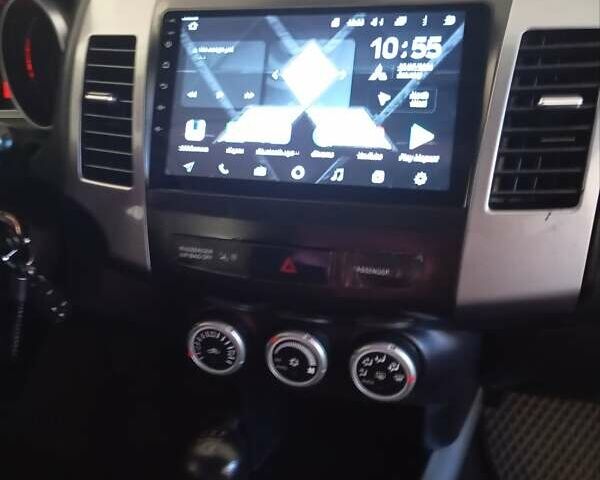 Черный Мицубиси Аутлендер, объемом двигателя 2.35 л и пробегом 245 тыс. км за 8000 $, фото 13 на Automoto.ua