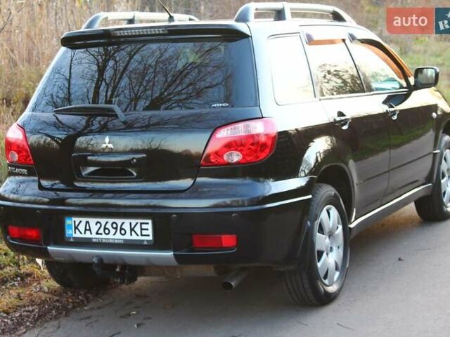 Черный Мицубиси Аутлендер, объемом двигателя 2 л и пробегом 190 тыс. км за 6900 $, фото 11 на Automoto.ua