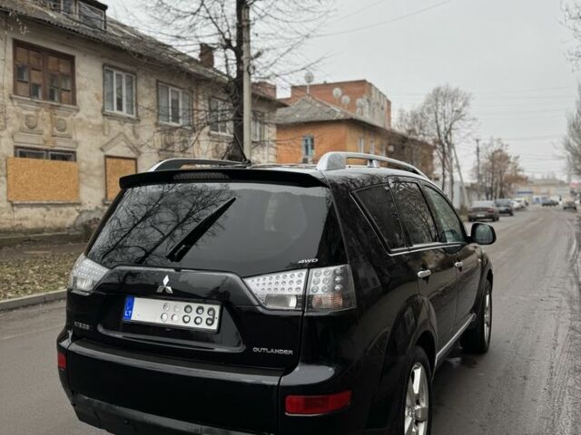 Черный Мицубиси Аутлендер, объемом двигателя 2 л и пробегом 377 тыс. км за 5200 $, фото 4 на Automoto.ua
