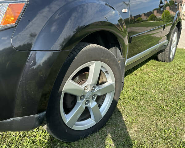 Черный Мицубиси Аутлендер, объемом двигателя 2.36 л и пробегом 240 тыс. км за 9599 $, фото 7 на Automoto.ua