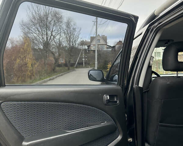 Чорний Міцубісі Аутлендер, об'ємом двигуна 2 л та пробігом 118 тис. км за 8100 $, фото 21 на Automoto.ua