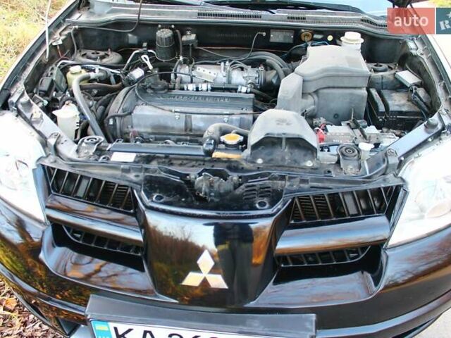 Черный Мицубиси Аутлендер, объемом двигателя 2 л и пробегом 190 тыс. км за 6900 $, фото 52 на Automoto.ua