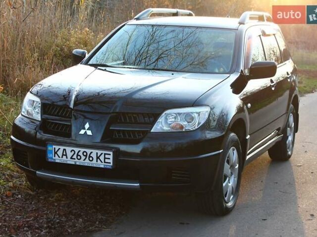 Черный Мицубиси Аутлендер, объемом двигателя 2 л и пробегом 190 тыс. км за 6900 $, фото 12 на Automoto.ua