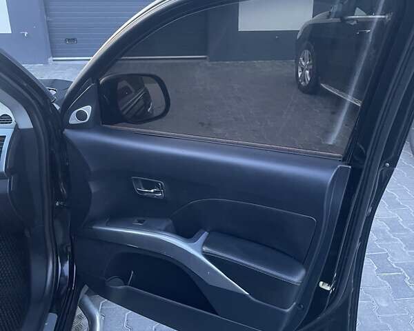 Черный Мицубиси Аутлендер, объемом двигателя 2.4 л и пробегом 290 тыс. км за 9500 $, фото 13 на Automoto.ua