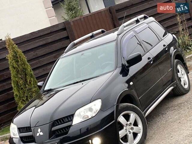 Черный Мицубиси Аутлендер, объемом двигателя 2.4 л и пробегом 178 тыс. км за 6900 $, фото 8 на Automoto.ua