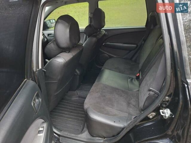 Чорний Міцубісі Аутлендер, об'ємом двигуна 2 л та пробігом 191 тис. км за 7100 $, фото 9 на Automoto.ua