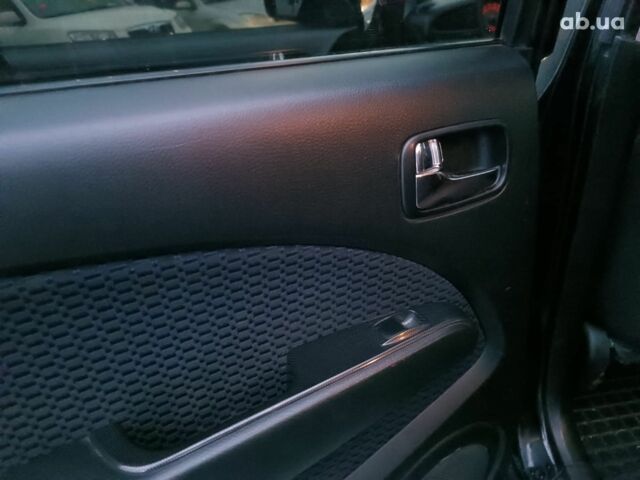 Черный Мицубиси Аутлендер, объемом двигателя 2 л и пробегом 271 тыс. км за 6940 $, фото 17 на Automoto.ua