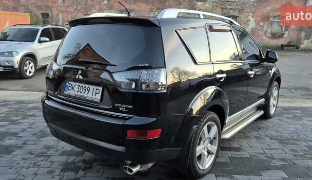 Чорний Міцубісі Аутлендер, об'ємом двигуна 2.4 л та пробігом 230 тис. км за 9700 $, фото 4 на Automoto.ua