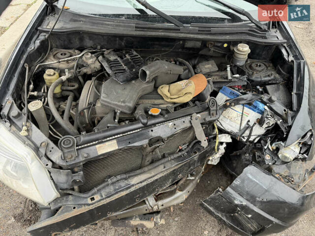 Черный Мицубиси Аутлендер, объемом двигателя 2 л и пробегом 200 тыс. км за 2999 $, фото 12 на Automoto.ua