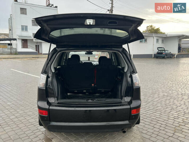 Черный Мицубиси Аутлендер, объемом двигателя 2.4 л и пробегом 230 тыс. км за 6650 $, фото 55 на Automoto.ua