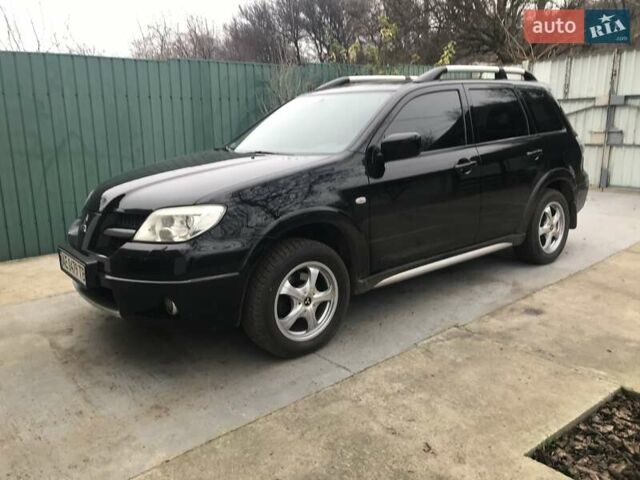 Чорний Міцубісі Аутлендер, об'ємом двигуна 2.38 л та пробігом 207 тис. км за 7000 $, фото 1 на Automoto.ua