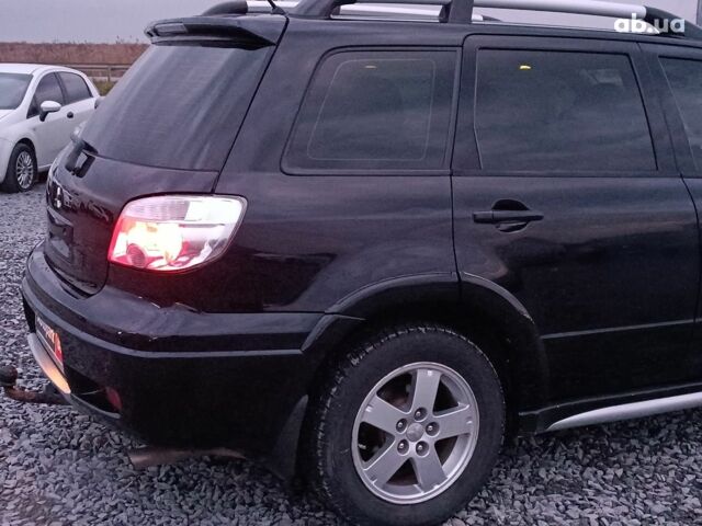 Черный Мицубиси Аутлендер, объемом двигателя 2 л и пробегом 271 тыс. км за 6940 $, фото 8 на Automoto.ua