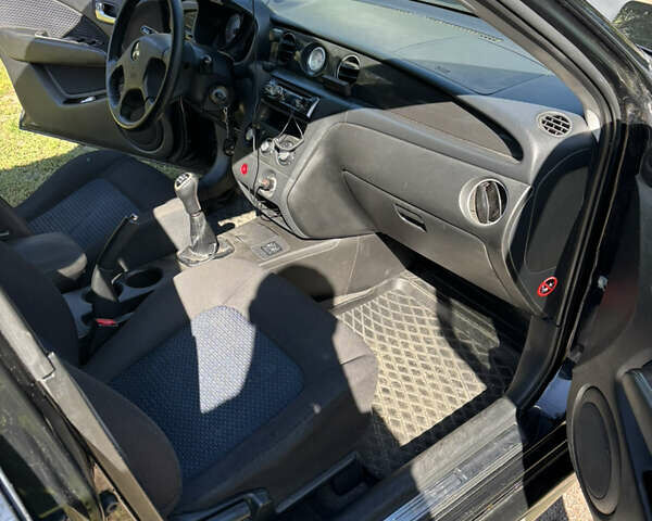 Міцубісі Аутлендер 2008 у Києві на Automoto.ua Чорний Міцубісі Аутлендер, об'ємом двигуна 2 л та пробігом 228 тис. км за 7300 $, фото 8 на Automoto.ua