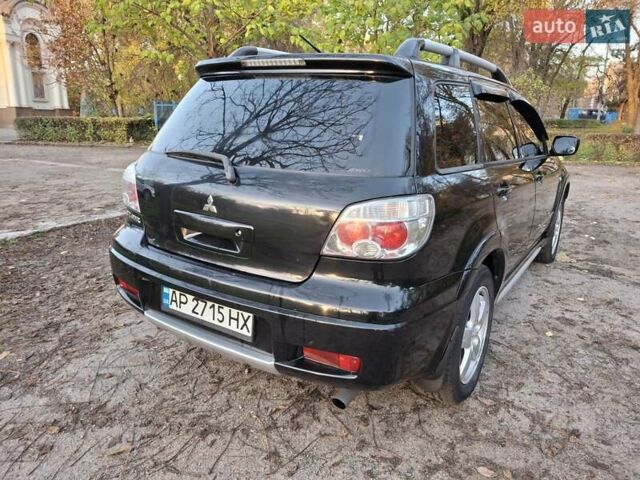 Чорний Міцубісі Аутлендер, об'ємом двигуна 2.38 л та пробігом 245 тис. км за 6800 $, фото 2 на Automoto.ua