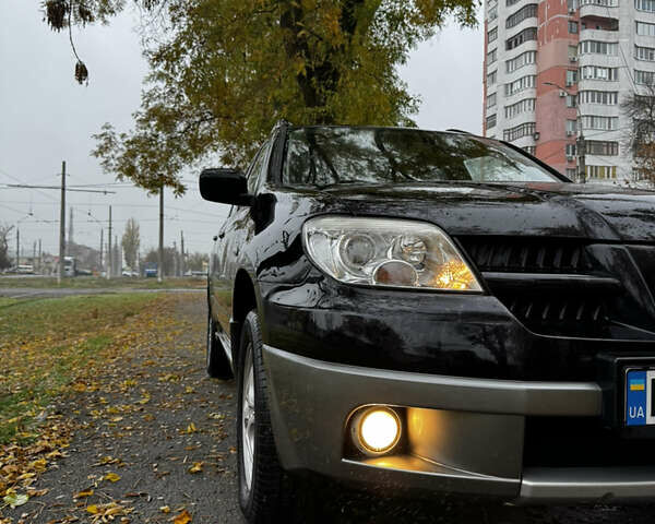 Чорний Міцубісі Аутлендер, об'ємом двигуна 2 л та пробігом 254 тис. км за 7499 $, фото 5 на Automoto.ua