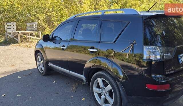 Черный Мицубиси Аутлендер, объемом двигателя 2.4 л и пробегом 178 тыс. км за 9150 $, фото 2 на Automoto.ua