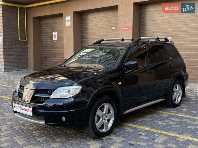 Черный Мицубиси Аутлендер, объемом двигателя 2 л и пробегом 270 тыс. км за 7199 $, фото 6 на Automoto.ua