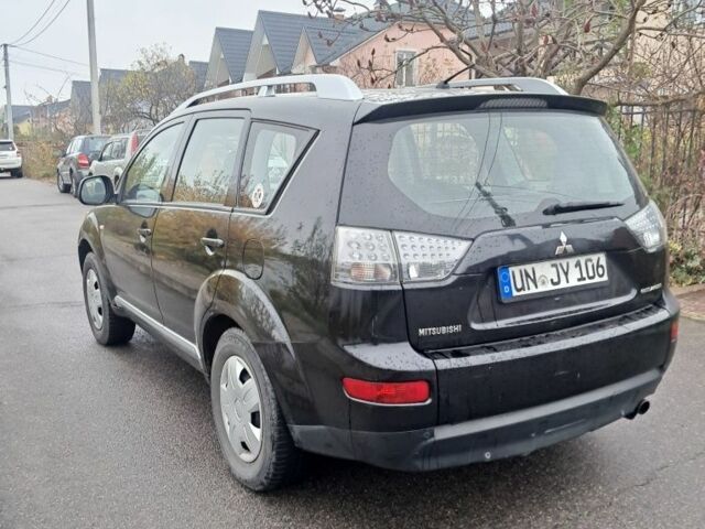 Черный Мицубиси Аутлендер, объемом двигателя 2 л и пробегом 226 тыс. км за 4700 $, фото 3 на Automoto.ua