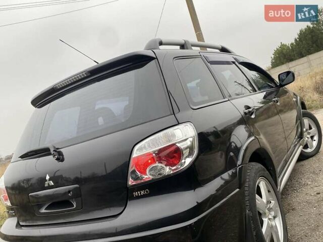 Черный Мицубиси Аутлендер, объемом двигателя 2.4 л и пробегом 178 тыс. км за 6900 $, фото 16 на Automoto.ua