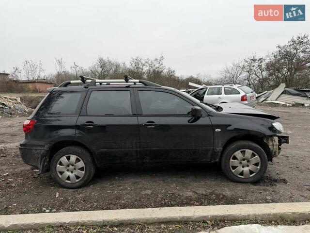Черный Мицубиси Аутлендер, объемом двигателя 2 л и пробегом 200 тыс. км за 2999 $, фото 2 на Automoto.ua