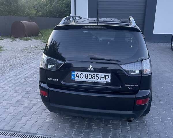 Черный Мицубиси Аутлендер, объемом двигателя 2.4 л и пробегом 290 тыс. км за 9500 $, фото 16 на Automoto.ua