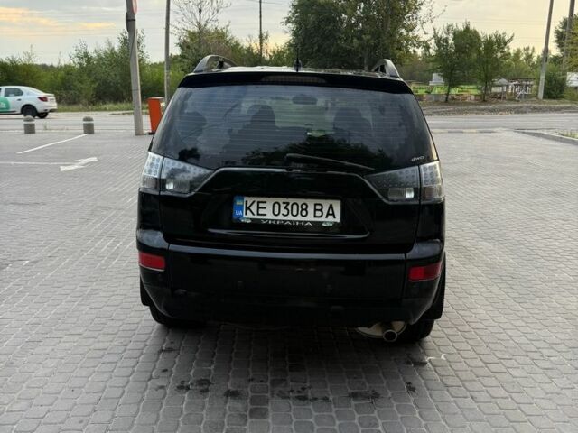 Черный Мицубиси Аутлендер, объемом двигателя 2.4 л и пробегом 369 тыс. км за 8500 $, фото 3 на Automoto.ua