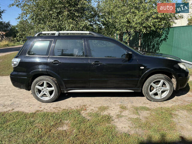 Міцубісі Аутлендер 2008 у Києві на Automoto.ua Чорний Міцубісі Аутлендер, об'ємом двигуна 2 л та пробігом 228 тис. км за 7300 $, фото 5 на Automoto.ua